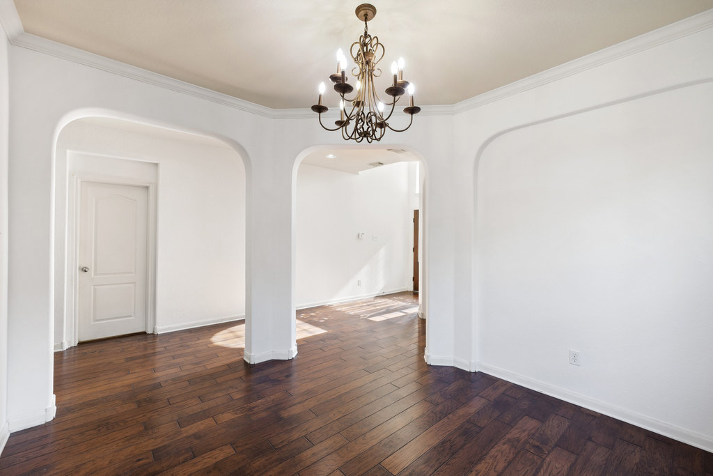 2617 Salorn Way Round Rock, TX 78681 - Photo 10 of 40 a view of a chandelier in big room with wooden floor