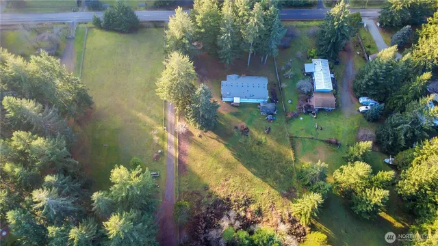 an aerial view of residential house with outdoor space and swimming pool