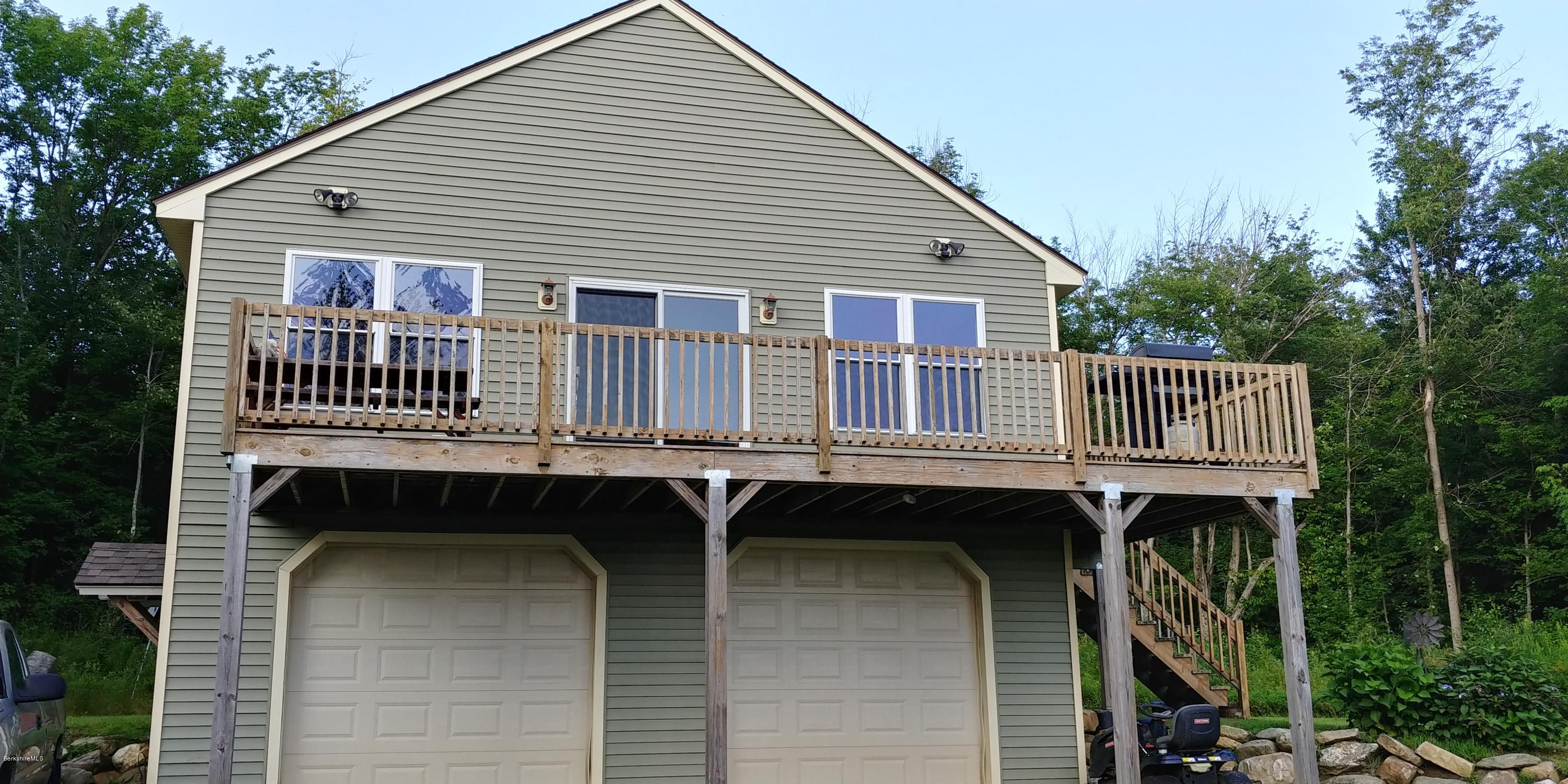 229 East Windsor Road Peru, MA 01235 - Photo 2 of 9 a front view of a house with balcony