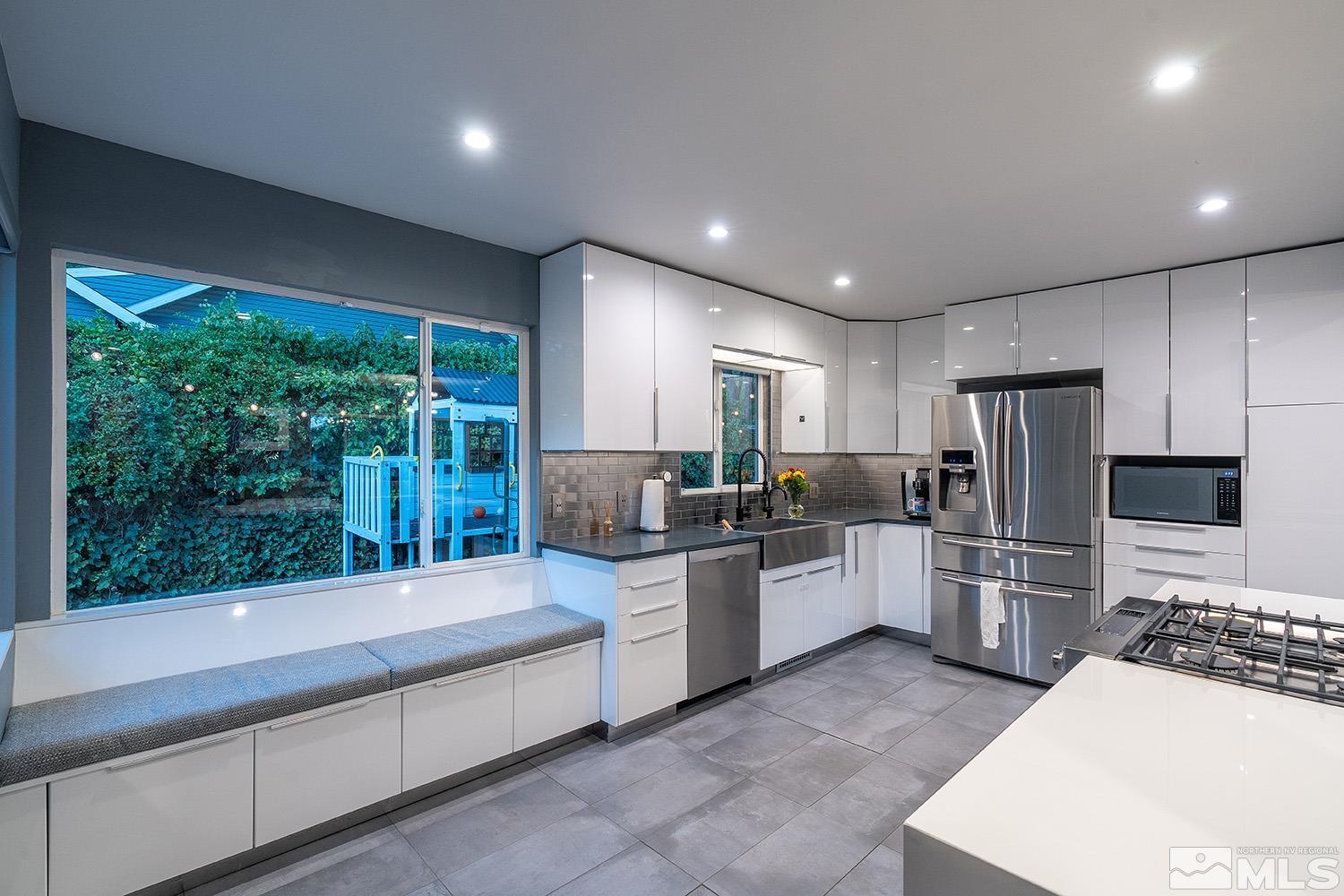 401 Brown Street Reno, NV 89509 - Photo 11 of 40 a large kitchen with a large window and stainless steel appliances