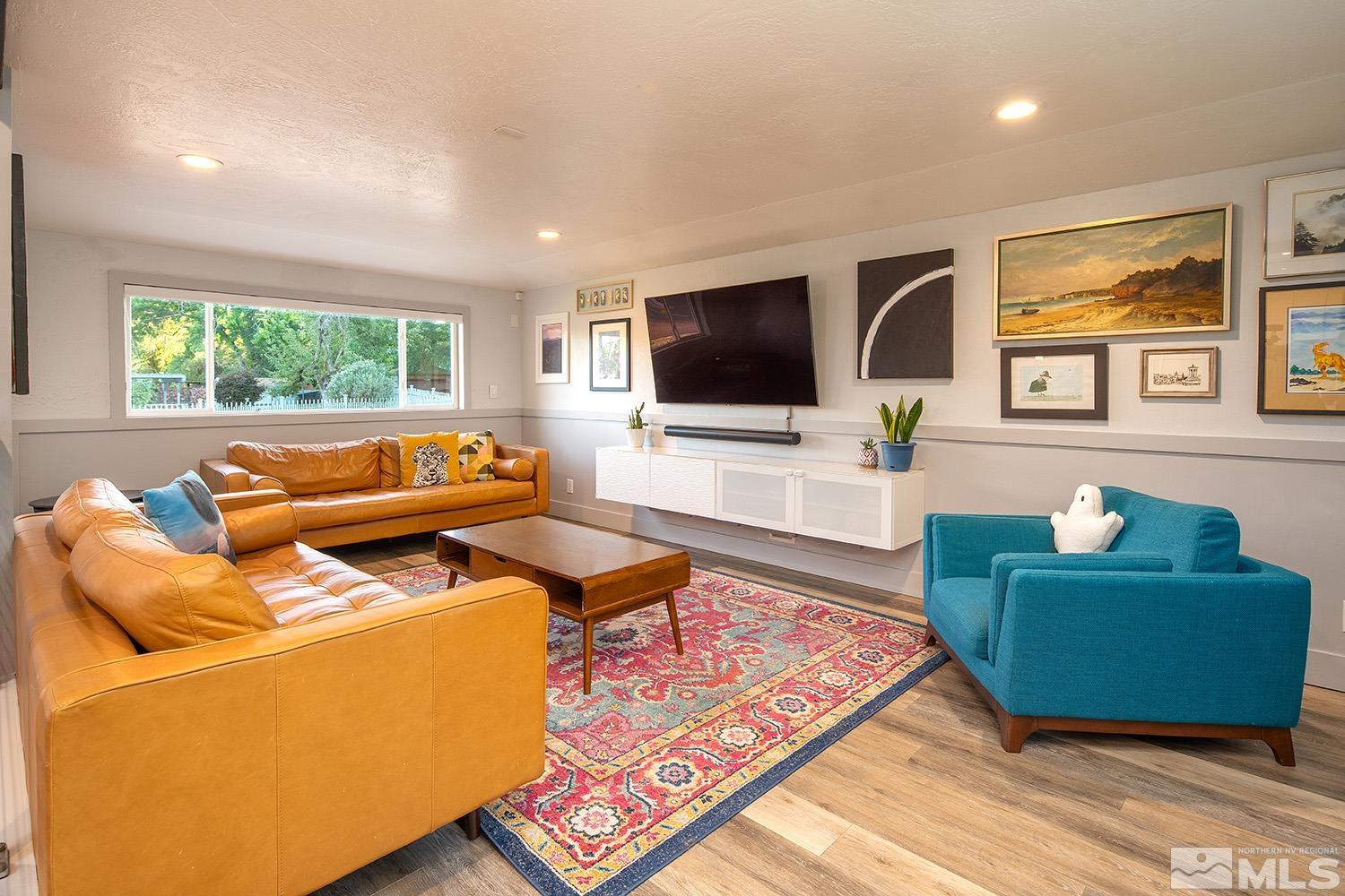 401 Brown Street Reno, NV 89509 - Photo 18 of 40 a living room with furniture and a flat screen tv