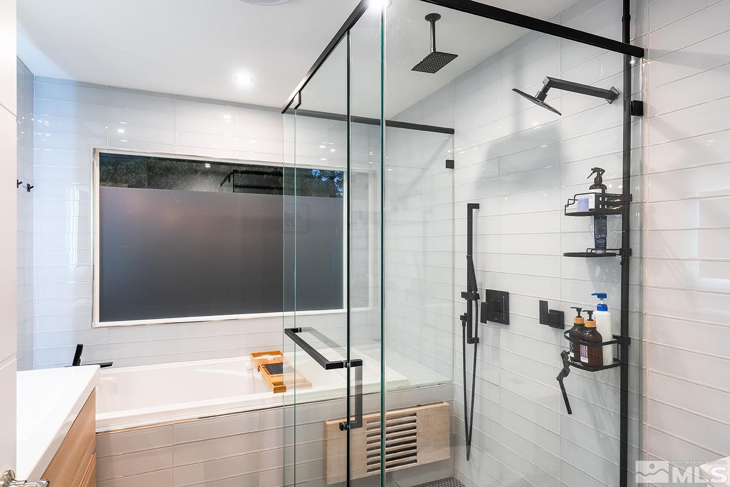 401 Brown Street Reno, NV 89509 - Photo 23 of 40 a bathroom with a tub and a shower