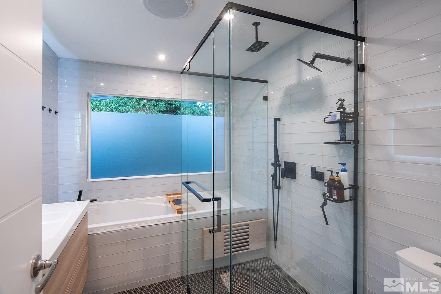 401 Brown Street Reno, NV 89509 - Photo 24 of 40 a bathroom with a bathtub and a shower