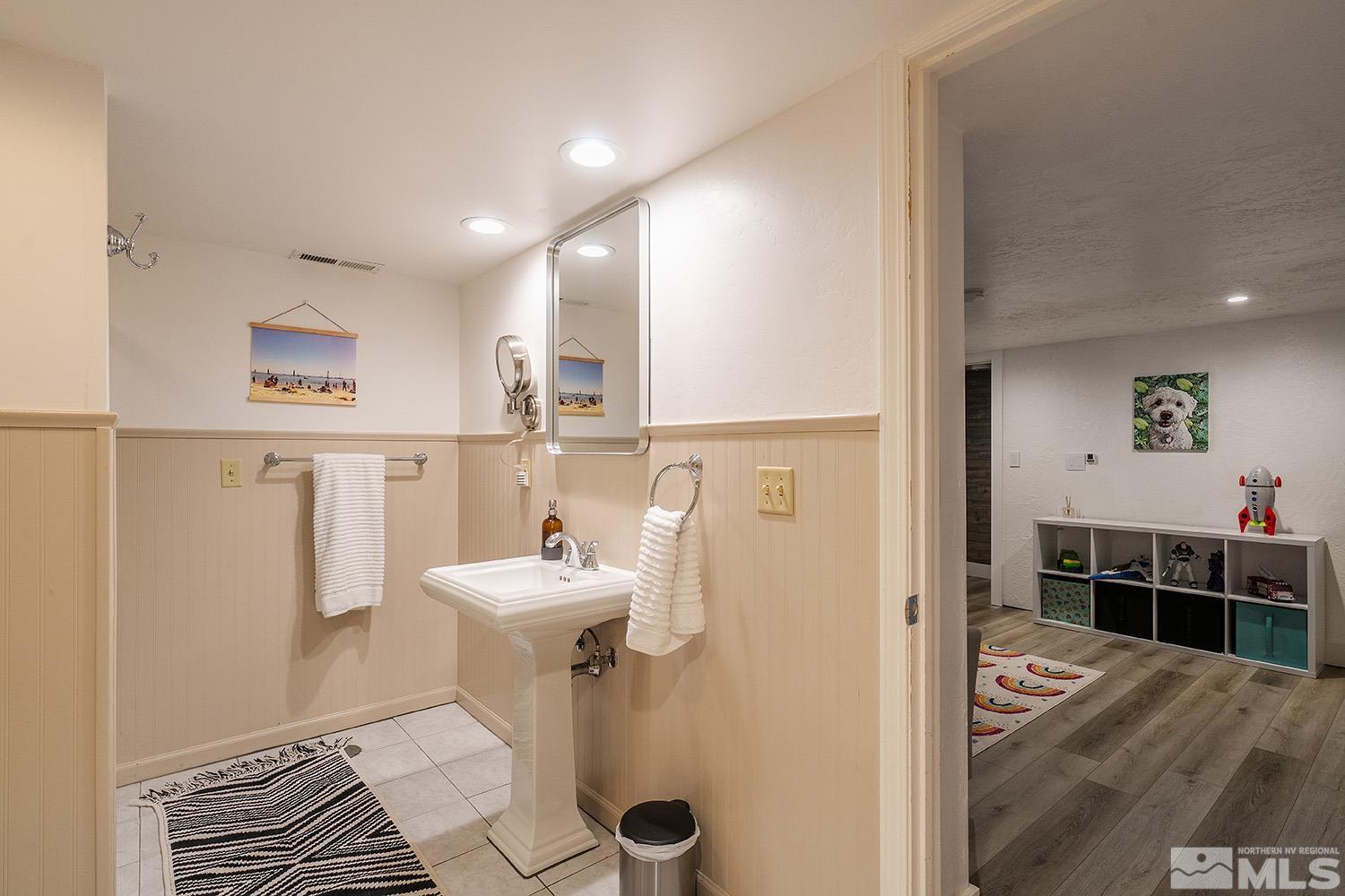 401 Brown Street Reno, NV 89509 - Photo 29 of 40 a bathroom with a sink and a mirror