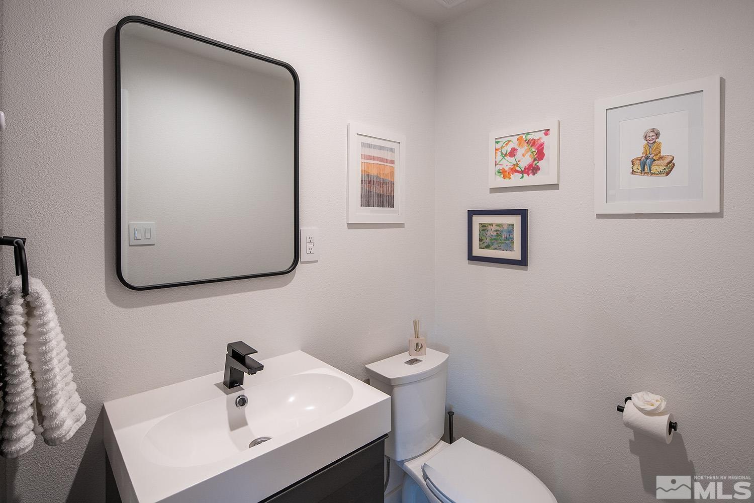 401 Brown Street Reno, NV 89509 - Photo 31 of 40 a bathroom with a sink mirror and toilet