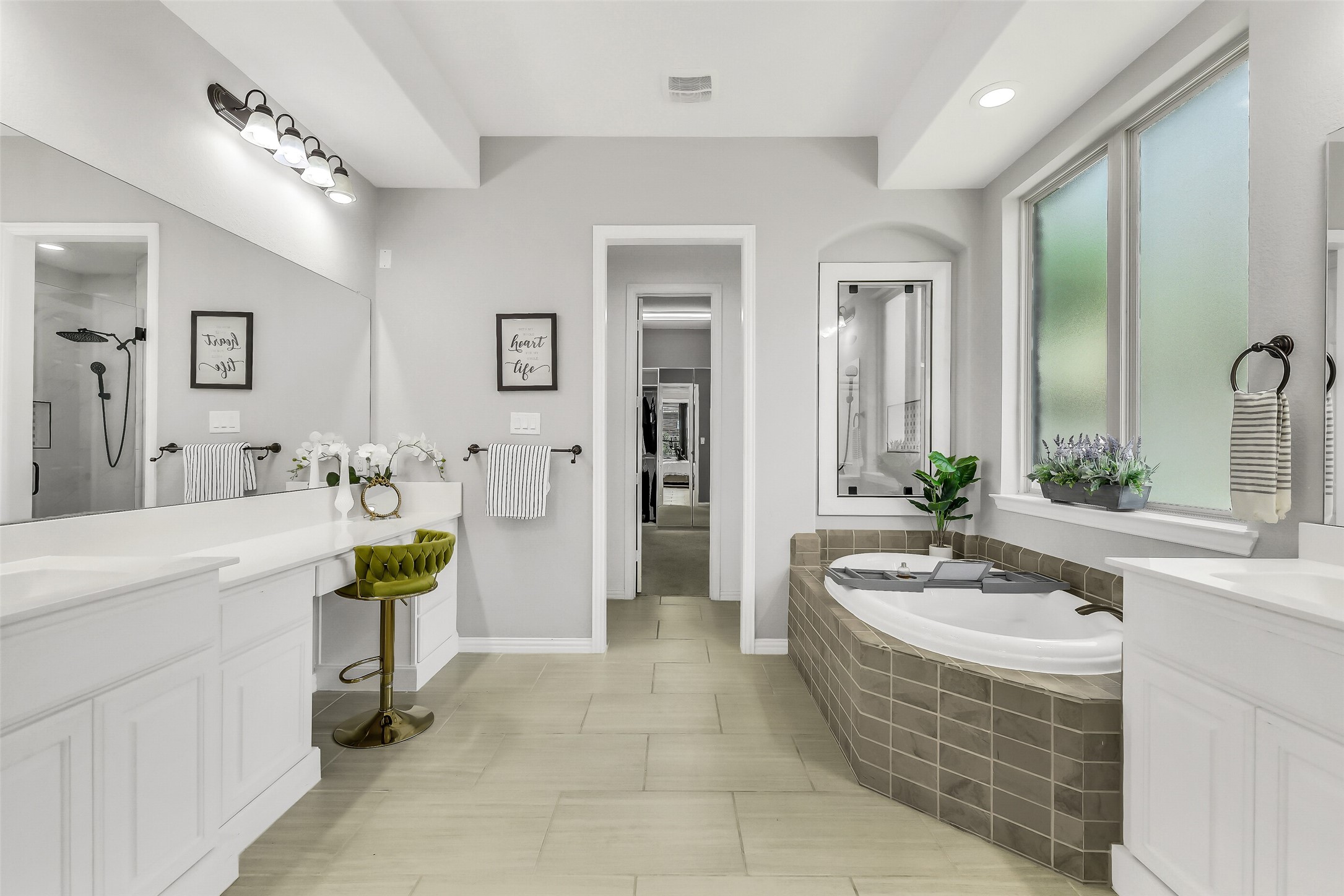 12207 Shorebridge Road Cypress, TX 77433 - Photo 20 of 41 a spacious bathroom with a tub sink and mirror