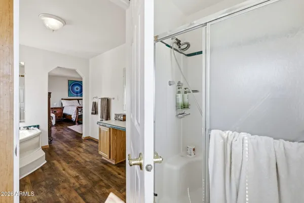 a view of a bedroom with furniture and windows