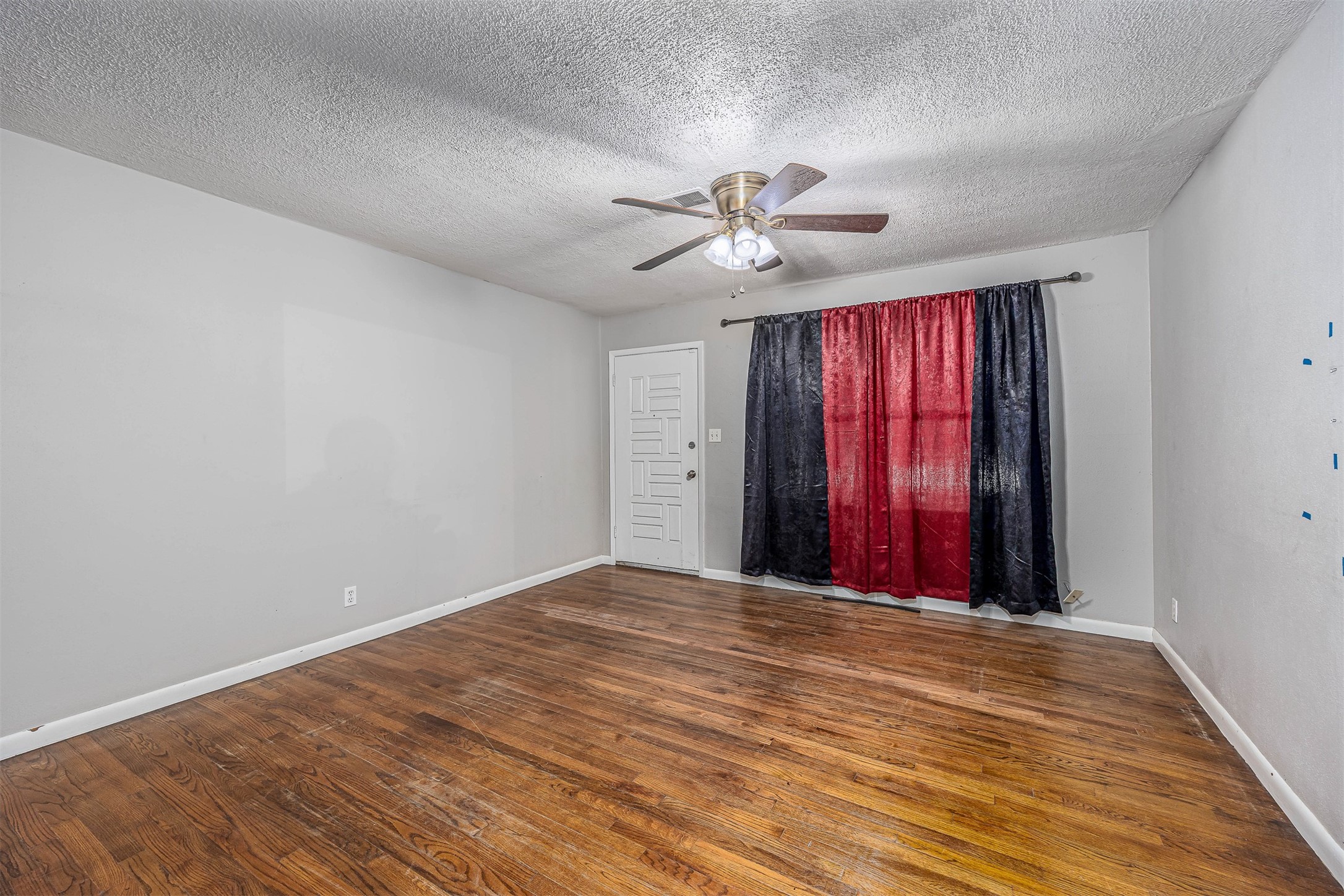 502 Massey Tompkins Road Baytown, TX 77521 - Photo 8 of 32 a view of an empty room with window and a ceiling fan