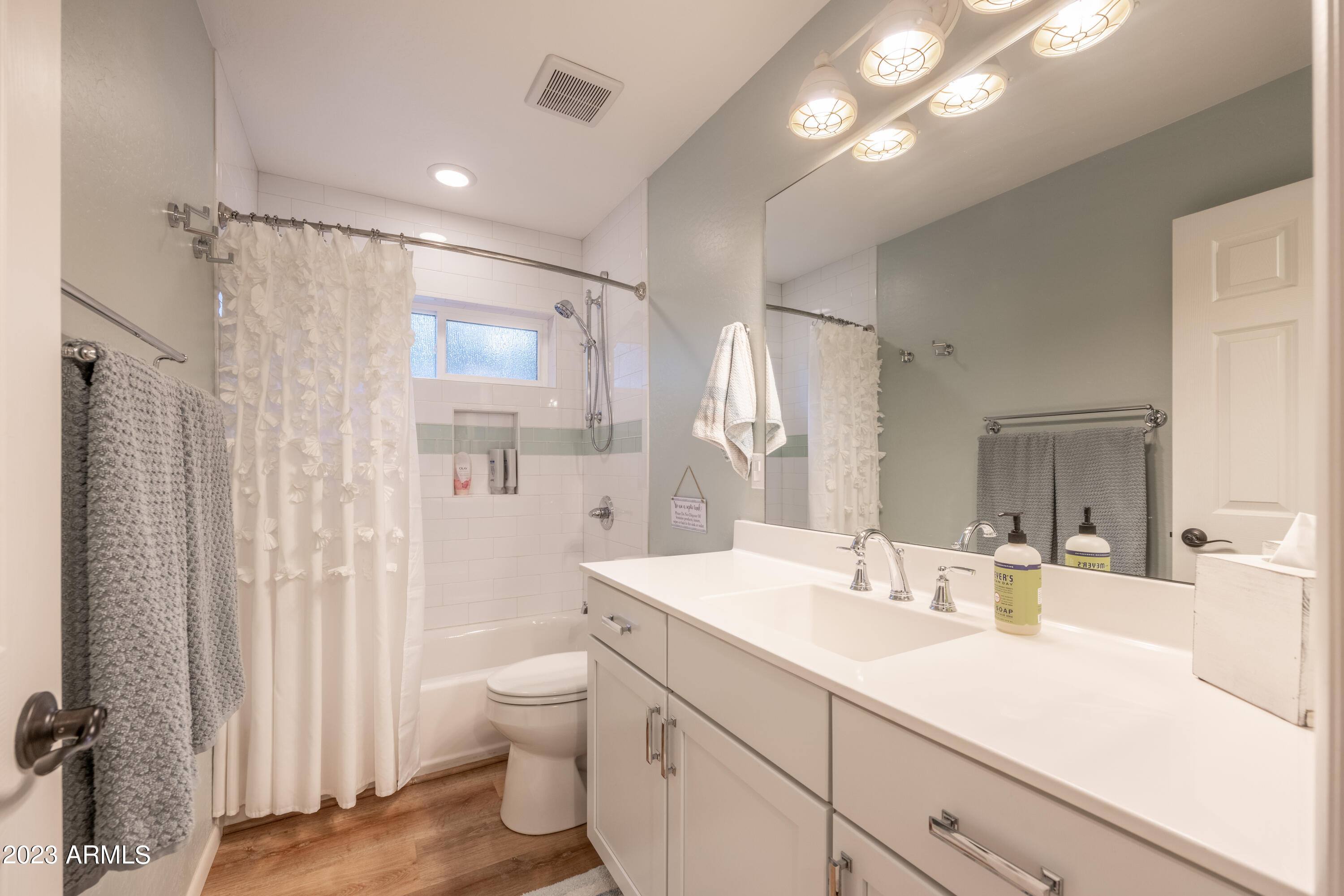 2772 Larson Loop Forest Lakes, AZ 85931 - Photo 23 of 65 a bathroom with a double vanity sink toilet mirror and shower