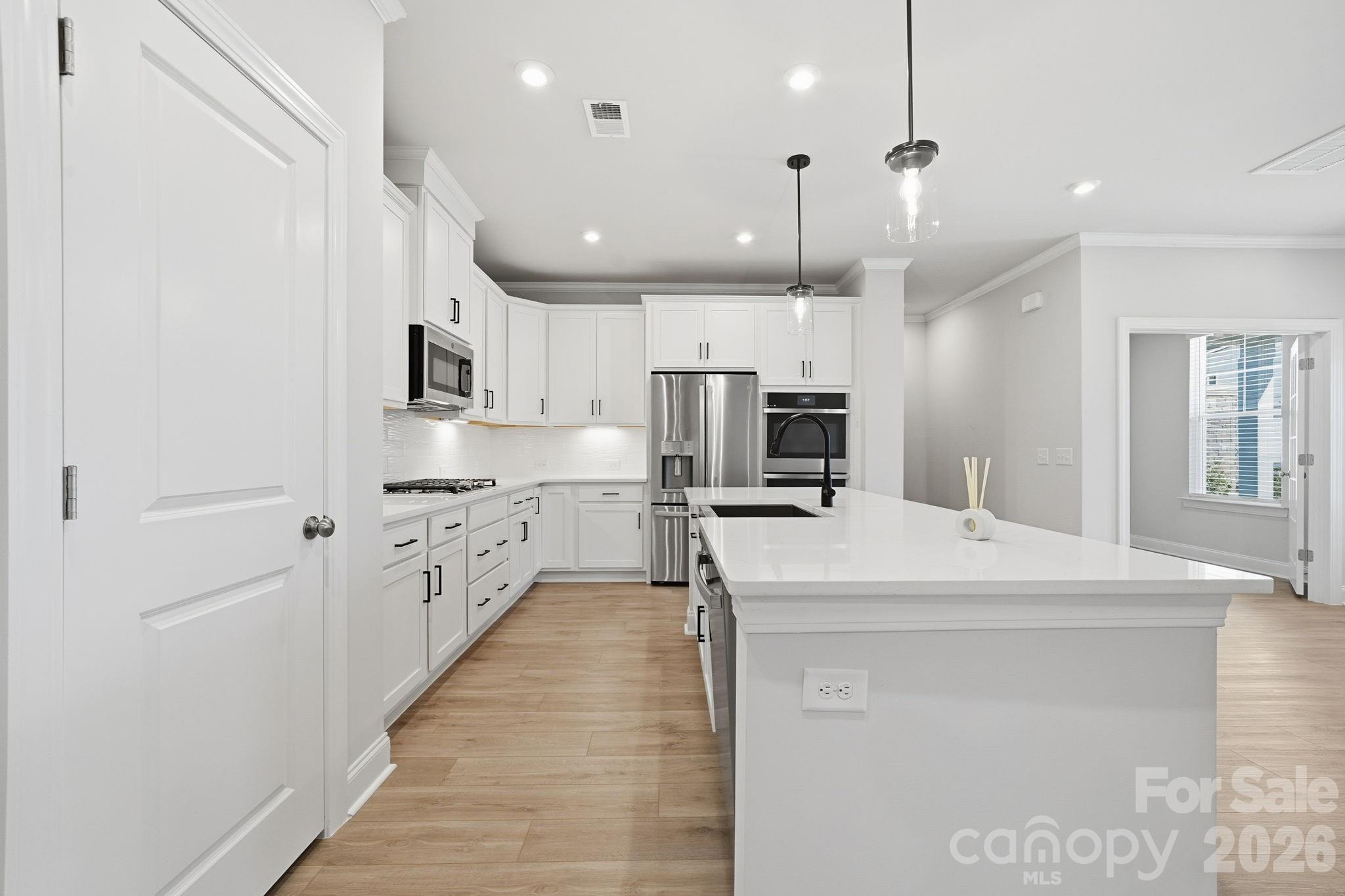 1823 Viewfield Road Fort Mill, SC 29708 - Photo 11 of 43 a large kitchen with kitchen island a sink stainless steel appliances and cabinets
