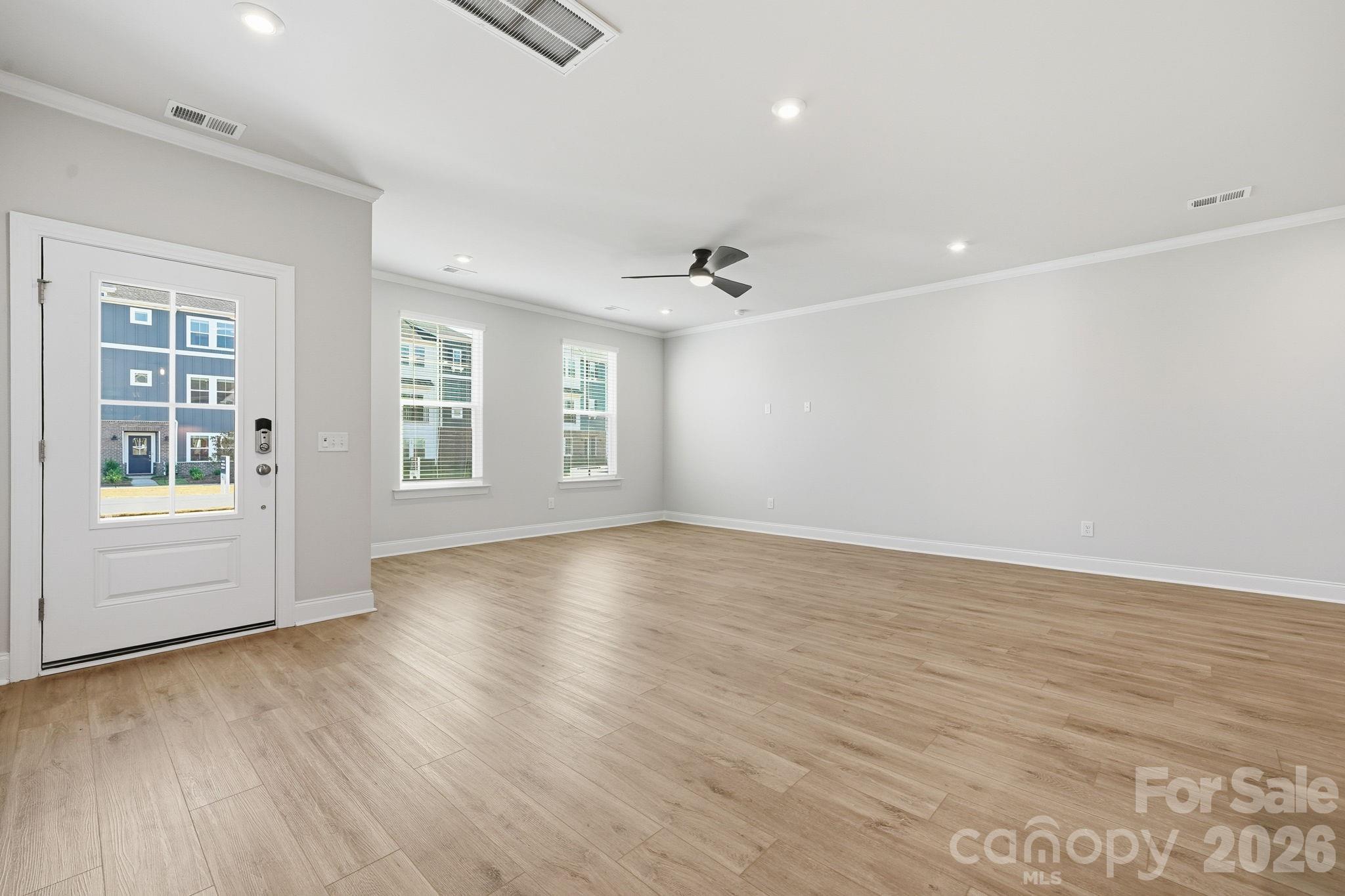 1823 Viewfield Road Fort Mill, SC 29708 - Photo 30 of 43 an empty room with wooden floor and windows
