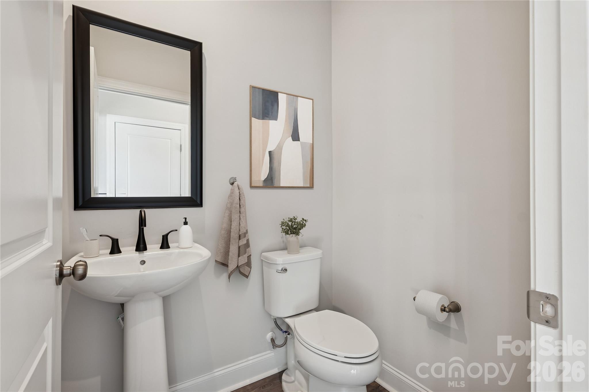 1823 Viewfield Road Fort Mill, SC 29708 - Photo 32 of 43 a bathroom with a toilet sink and mirror