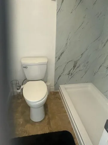 a bathroom with a toilet and a sink