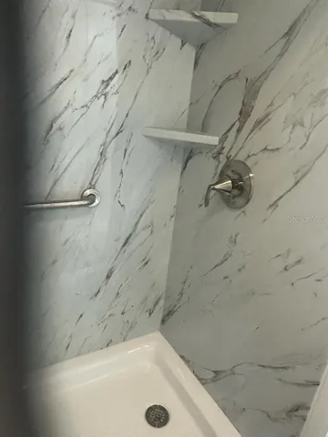 a bathroom with a bath tub