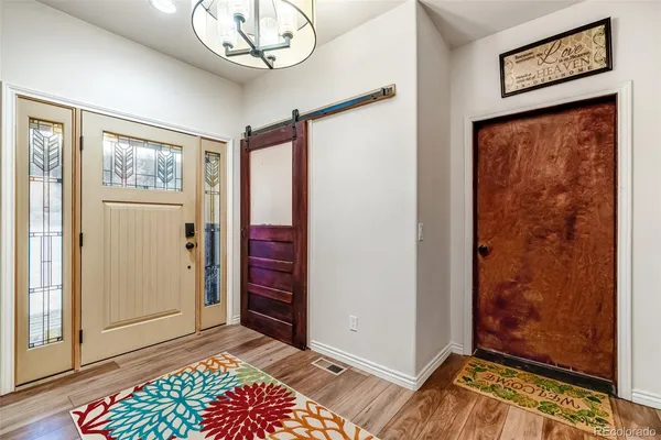 a view of an entryway with a workspace