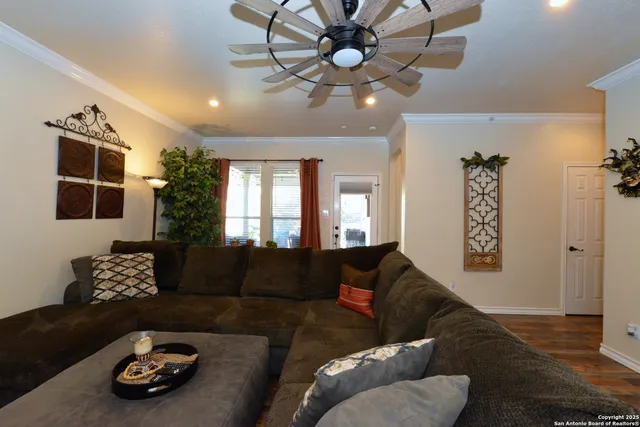 a living room with furniture and a window