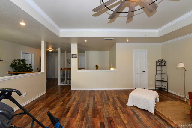 a bedroom with furniture and a chandelier