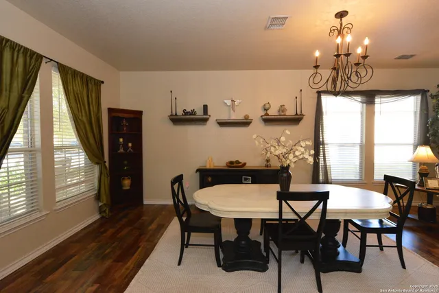 a view of a dining room with furniture window and outside view