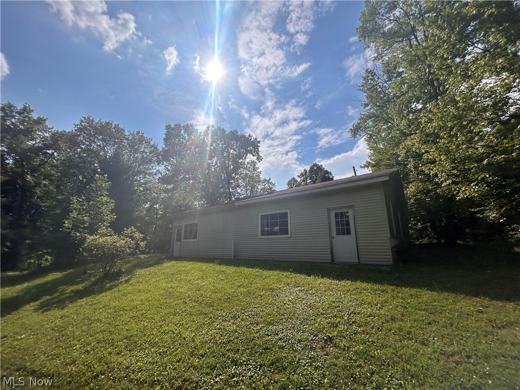 27762 Norris Road Tippecanoe, OH 44699 - Photo 22 of 24 Rear view of property with a yard