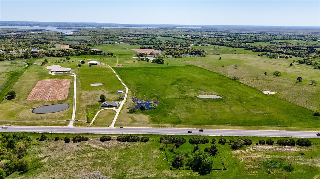 Nearby Lake Texoma adds charm to this 30-acre green tract on the right of this photo.