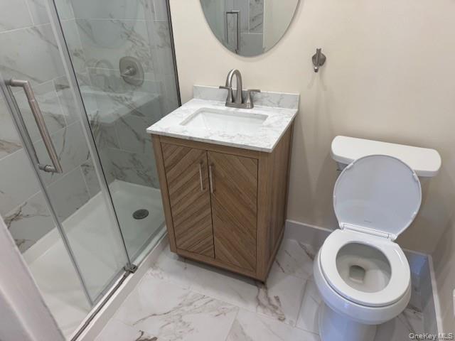 250 West Merrick Road, Unit 2R Freeport, NY 11520 - Photo 12 of 25 Bathroom featuring marble look tile flooring, a stall shower, and vanity