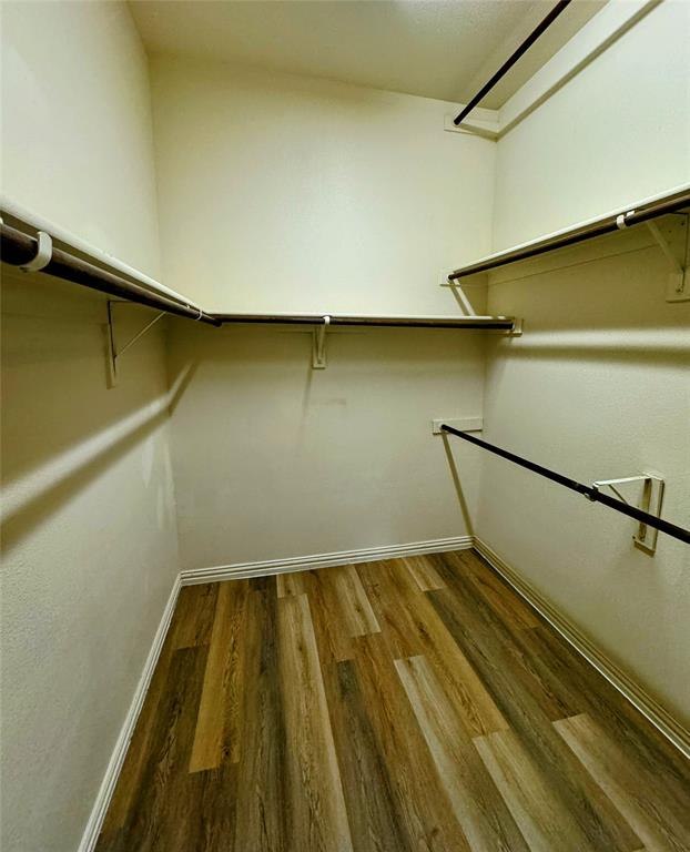 236 Archer Way Forney, TX 75126 - Photo 29 of 35 a view of a room with wooden floor and white walls