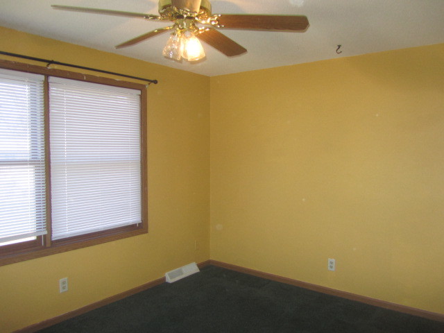 25696 Raska Lane Lake Villa, IL 60046 - Photo 17 of 27 an empty room with a window and a ceiling fan