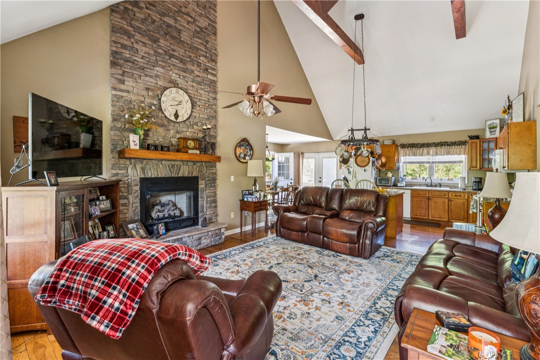 189 Little Choestoea Road Westminster, SC 29693 - Photo 5 of 38 This inviting great room showcases a rustic stone fireplace and vaulted ceilings.