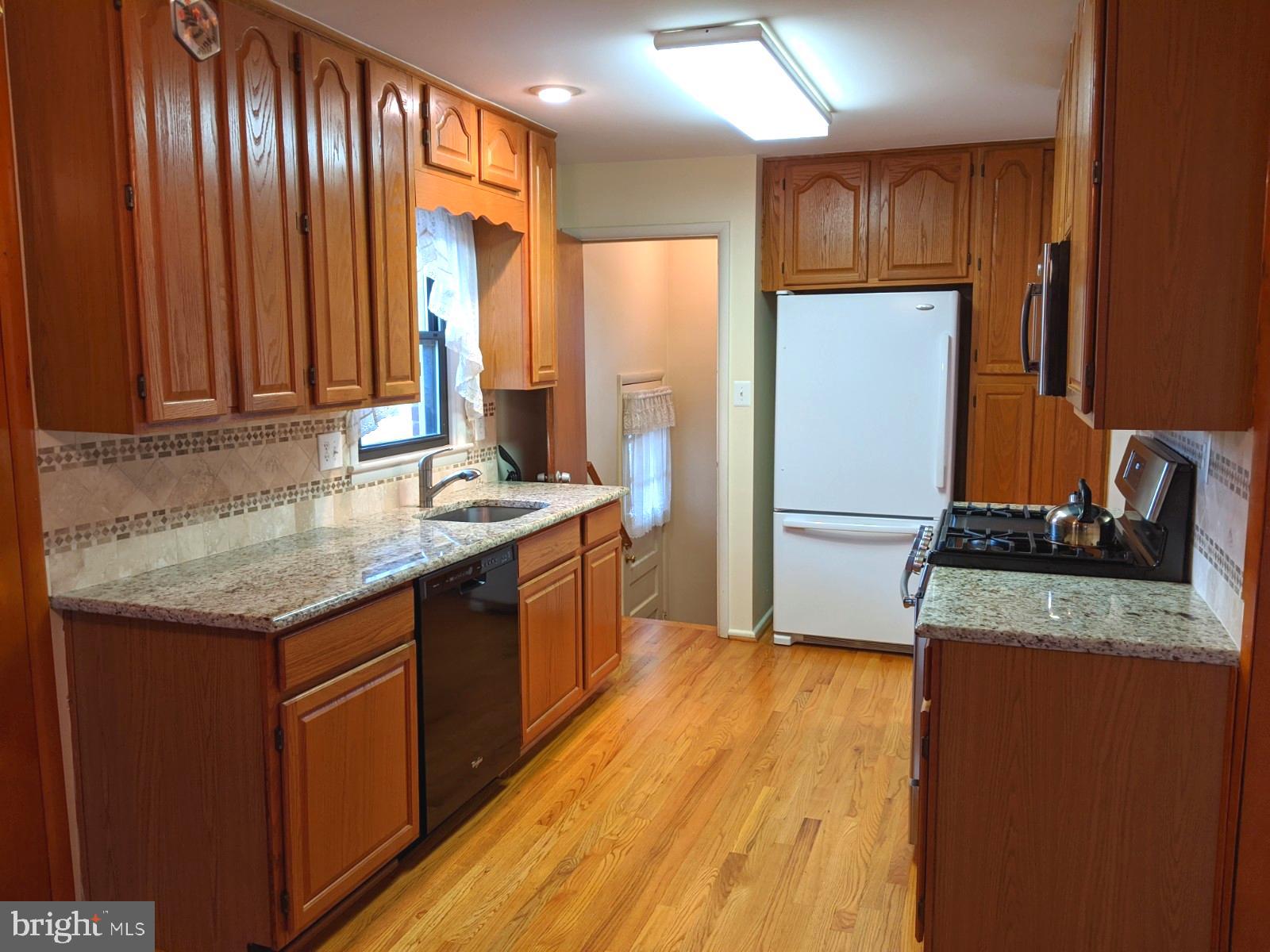 6711 Jerome Street Springfield, VA 22150 - Photo 10 of 24 Updated kitchen has granite counters