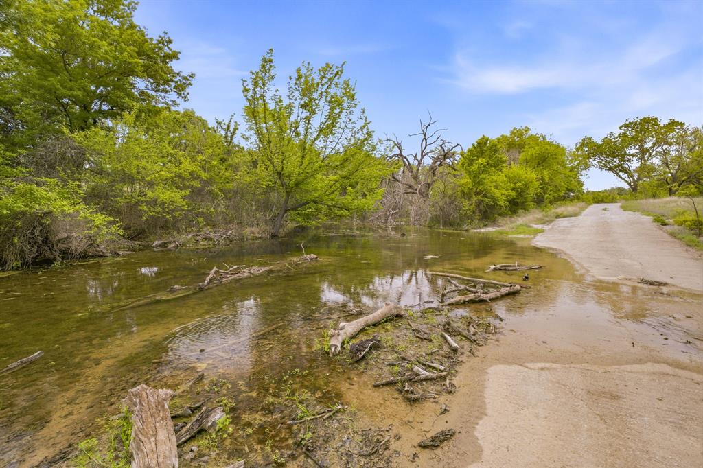 4823 Airport Road Aledo, TX 76008 - Photo 11 of 39 a view of a lake with a yard