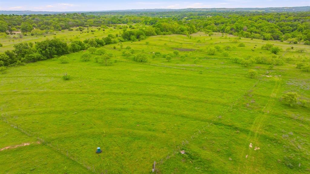 4823 Airport Road Aledo, TX 76008 - Photo 12 of 39 a view of a big yard with lots of green space and mountain view