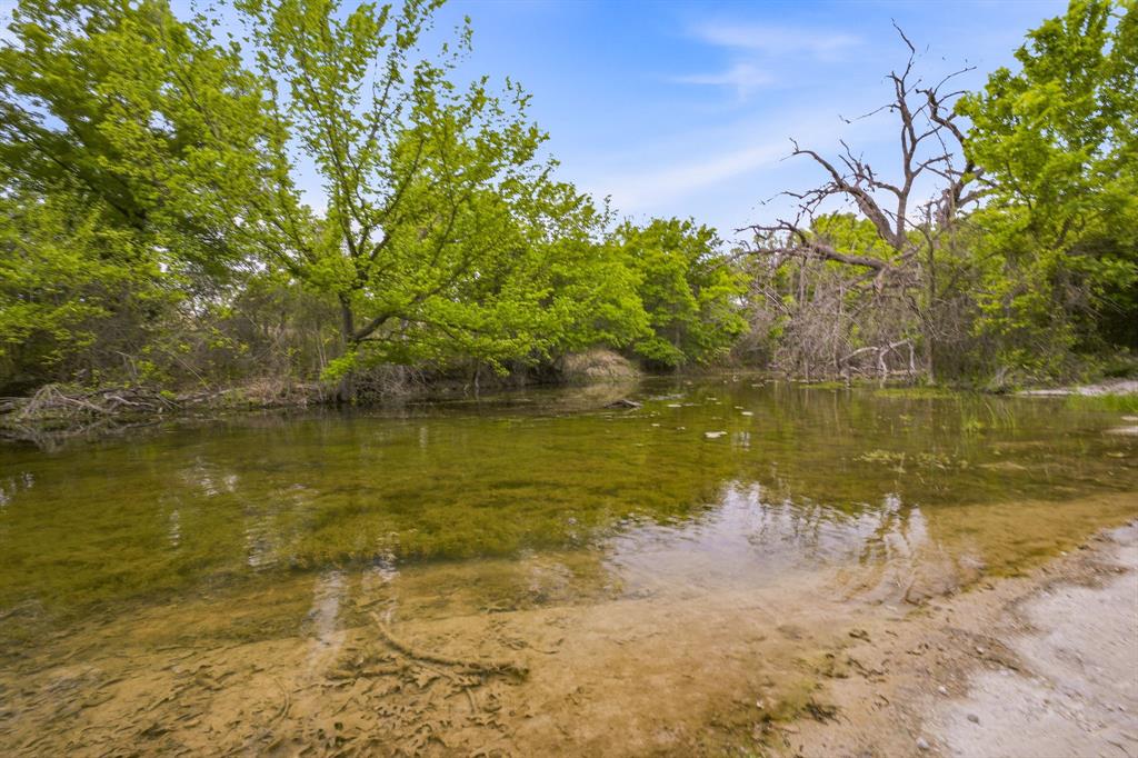 4823 Airport Road Aledo, TX 76008 - Photo 27 of 39 a view of a lake with a yard