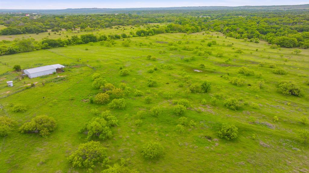 4823 Airport Road Aledo, TX 76008 - Photo 9 of 39 a view of a green field with lots of trees in it