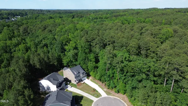a aerial view of a house with a yard