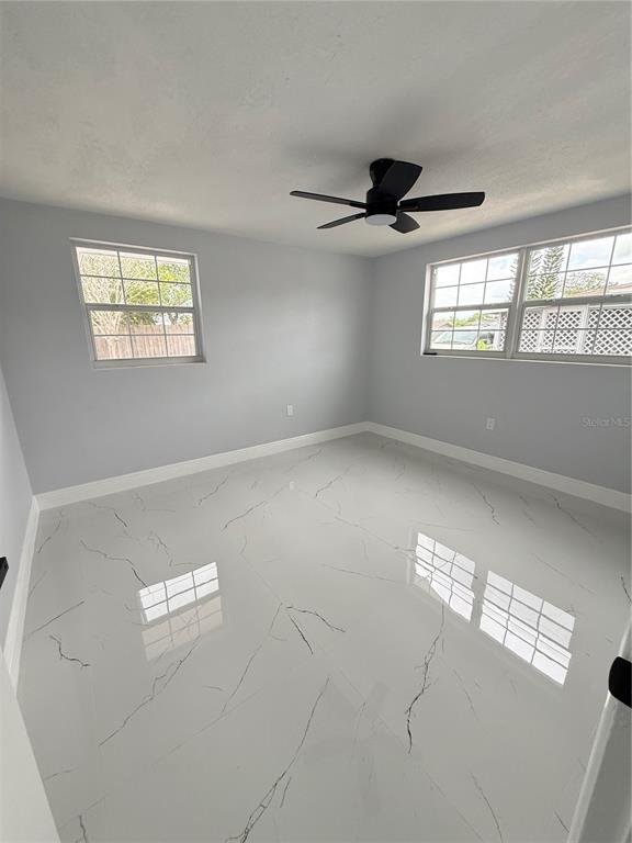 10433 Laburnum Drive Port Richey, FL 34668 - Photo 12 of 26 a view of an empty room and window