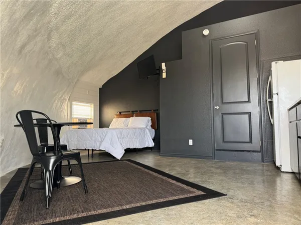 a bedroom with a bed and a cabinets