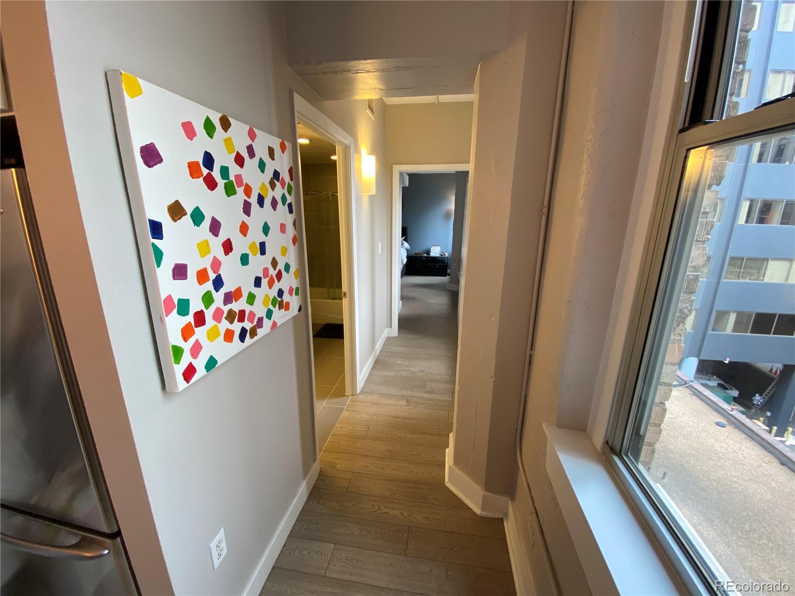 444 17th Street, Unit 508 Denver, CO 80202 - Photo 17 of 28 a view of a hallway with furniture and toys