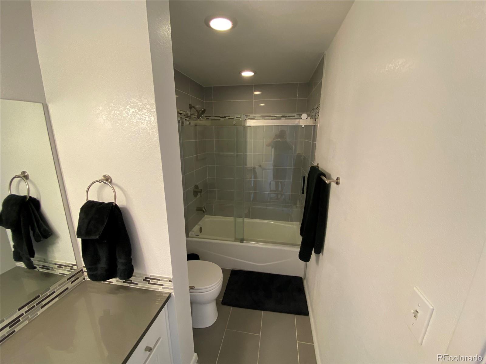 444 17th Street, Unit 508 Denver, CO 80202 - Photo 19 of 28 a bathroom with a tub a sink and a shower