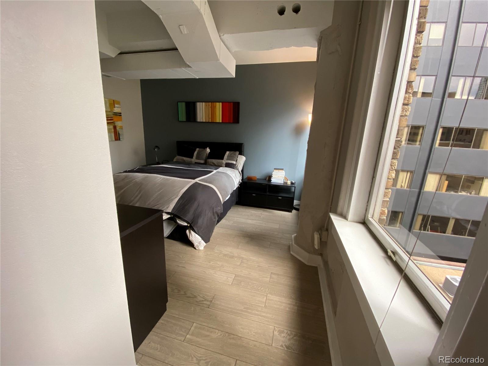 444 17th Street, Unit 508 Denver, CO 80202 - Photo 21 of 28 a view of a living room with furniture and a flat screen tv