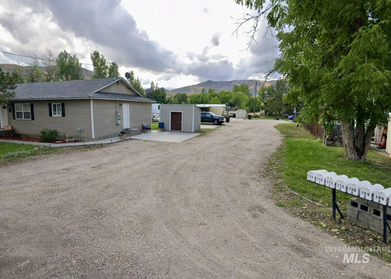 Entrance to mobile home park + side of duplex