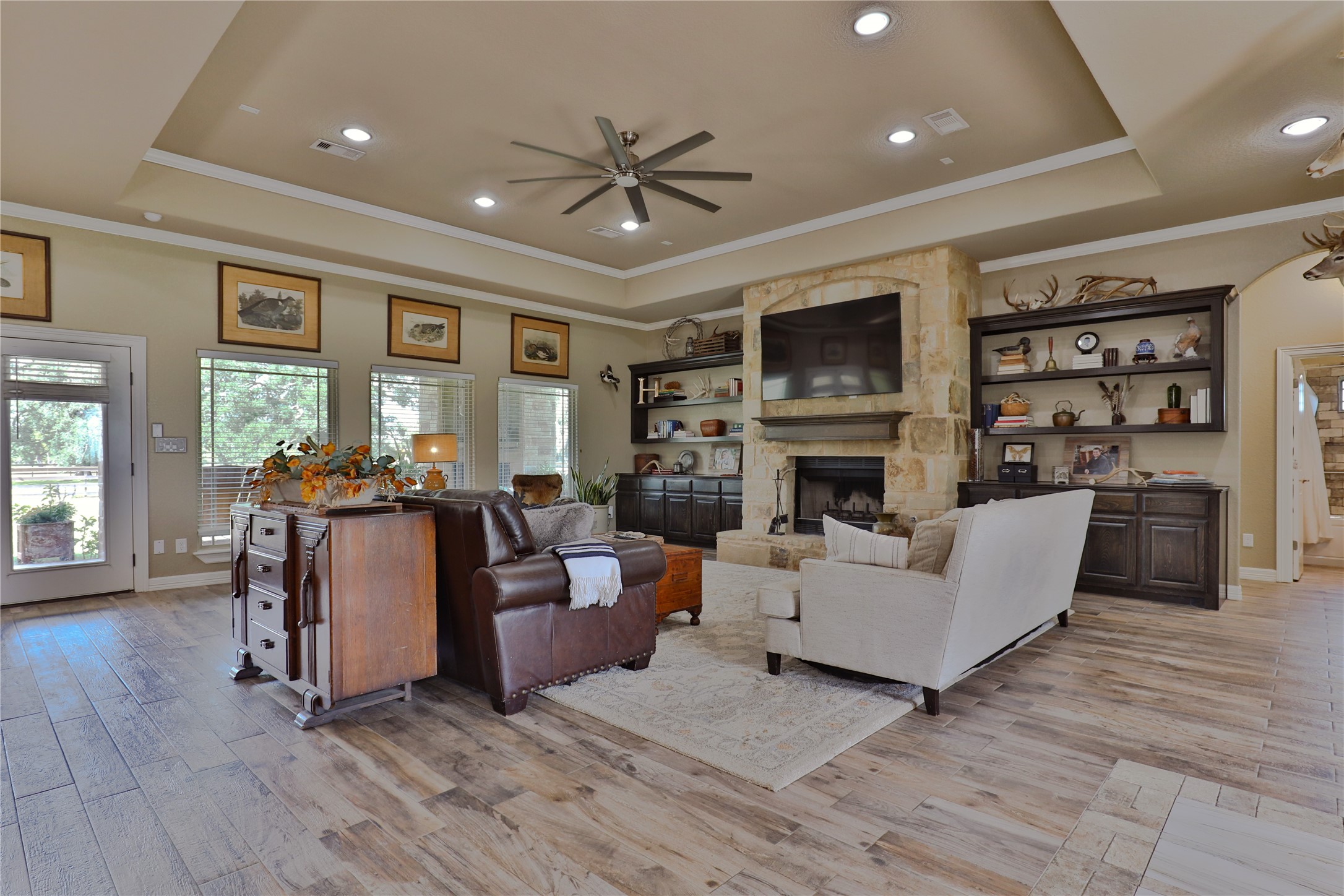 814 Comanche Trail Drive Rosharon, TX 77583 - Photo 11 of 50 a living room with fireplace furniture and a flat screen tv
