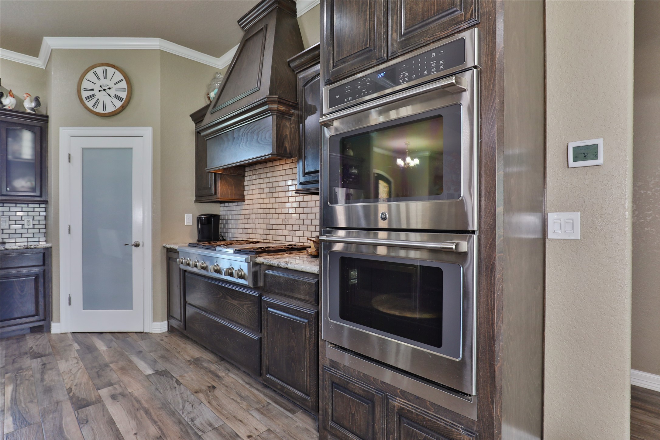 814 Comanche Trail Drive Rosharon, TX 77583 - Photo 15 of 50 a kitchen with stainless steel appliances granite countertop a stove and a refrigerator