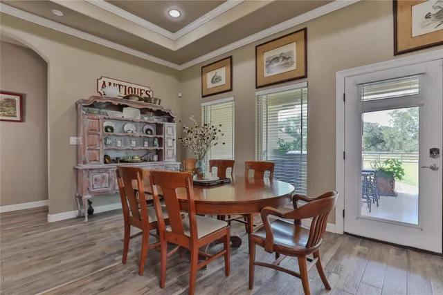 a view of a dining room with furniture window and wooden floor