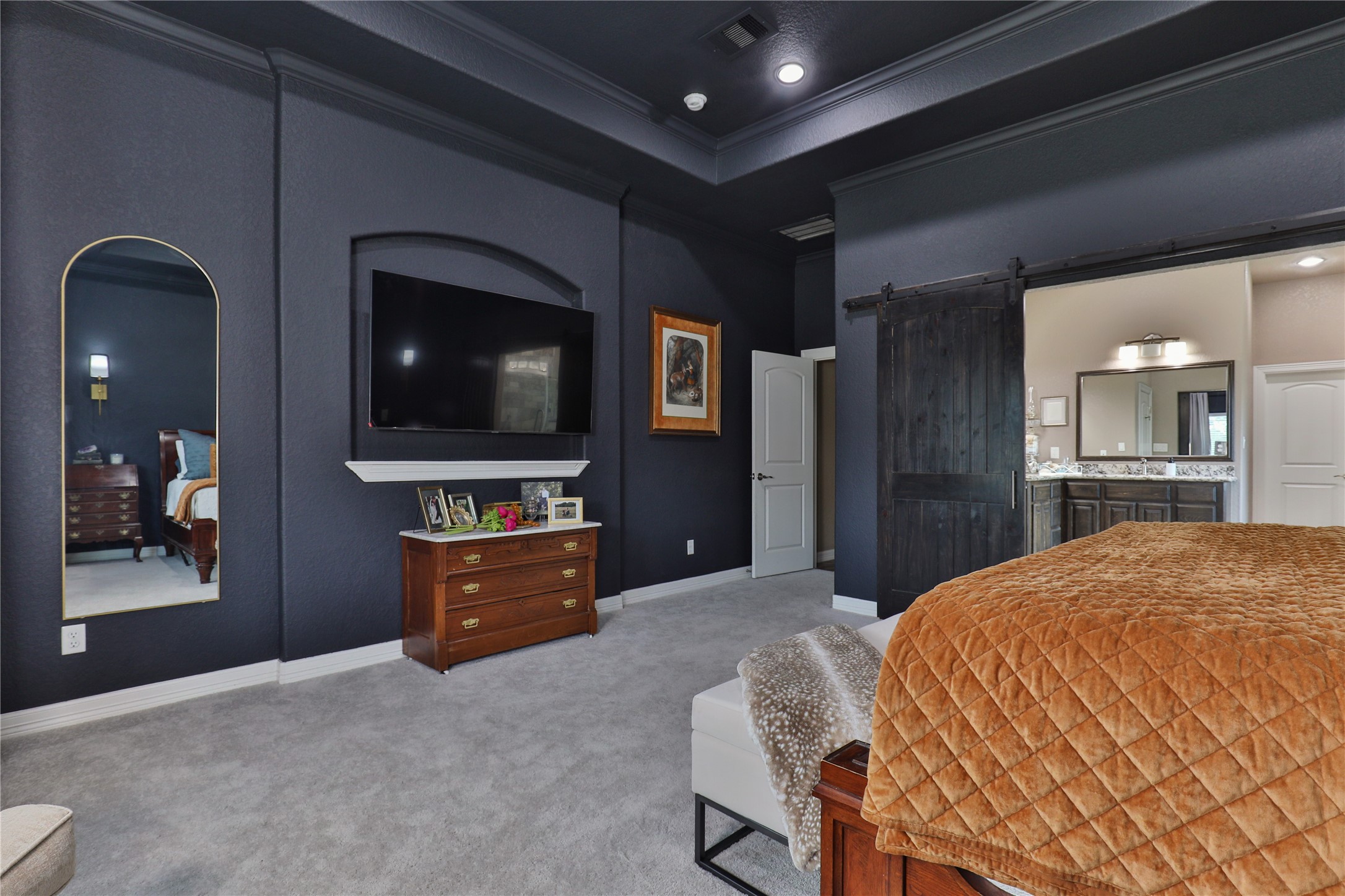 814 Comanche Trail Drive Rosharon, TX 77583 - Photo 23 of 50 a bedroom with a bed and a flat screen tv