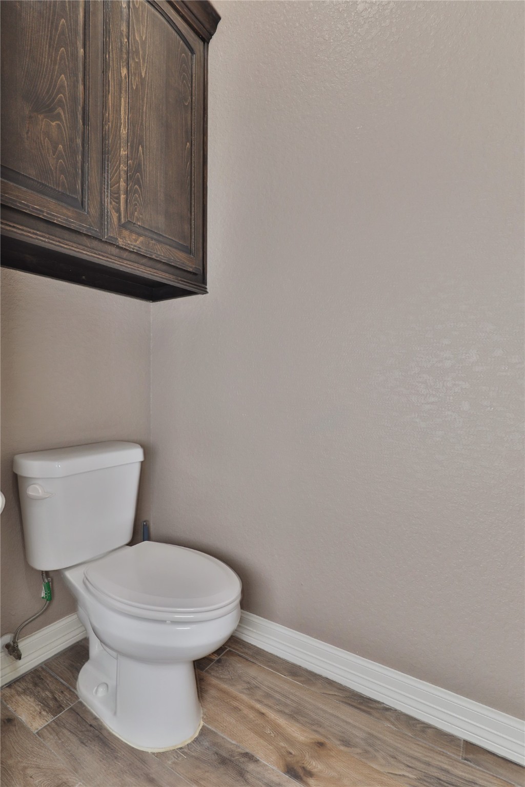 814 Comanche Trail Drive Rosharon, TX 77583 - Photo 28 of 50 a white toilet sitting next to a window