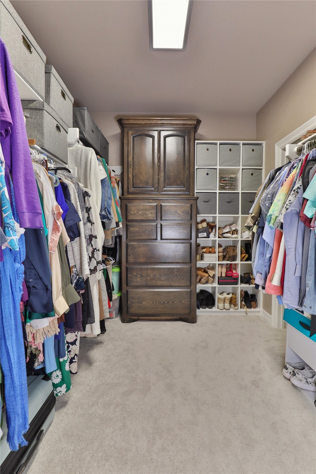 814 Comanche Trail Drive Rosharon, TX 77583 - Photo 29 of 50 a view of walk in closet with clothes and shoes