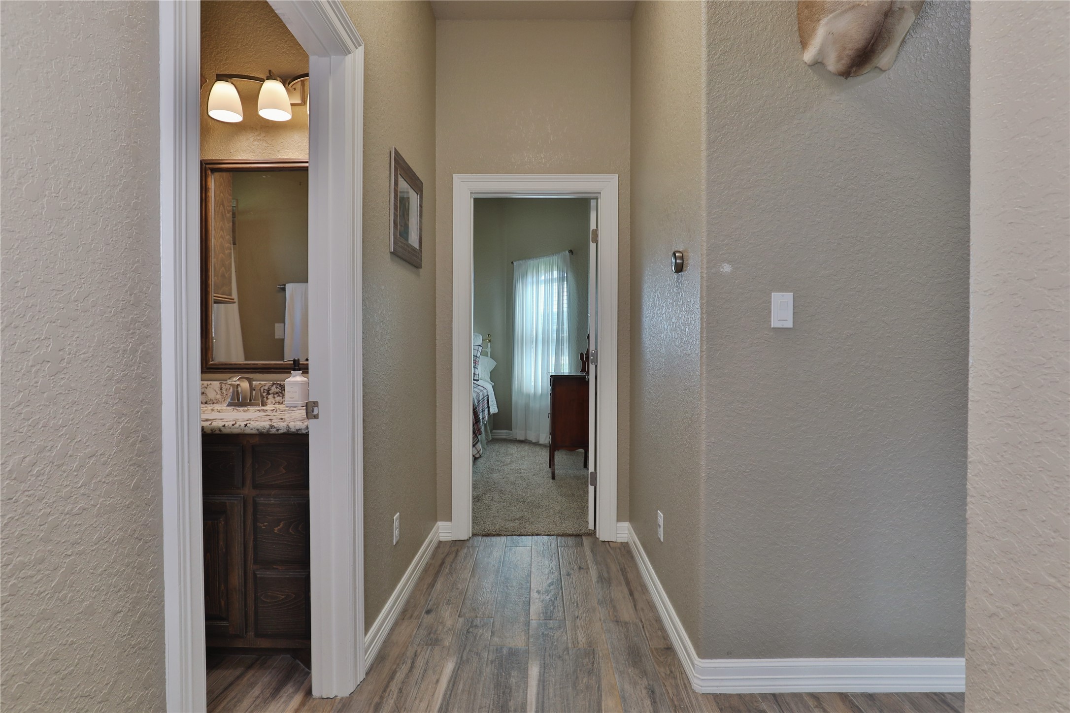 814 Comanche Trail Drive Rosharon, TX 77583 - Photo 32 of 50 a view of a hallway with wooden floor and closet