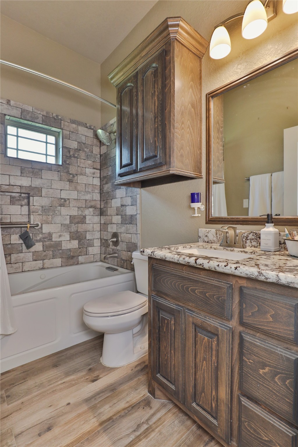 814 Comanche Trail Drive Rosharon, TX 77583 - Photo 35 of 50 a bathroom with a granite countertop toilet sink and mirror
