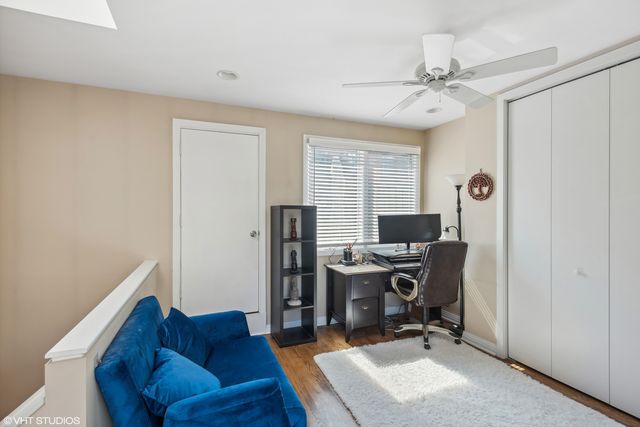 a view of workspace with a window and cabinet