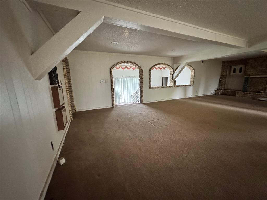 3909 Smothers Road Caney City, TX 75148 - Photo 10 of 35 a view of a livingroom with a staircase